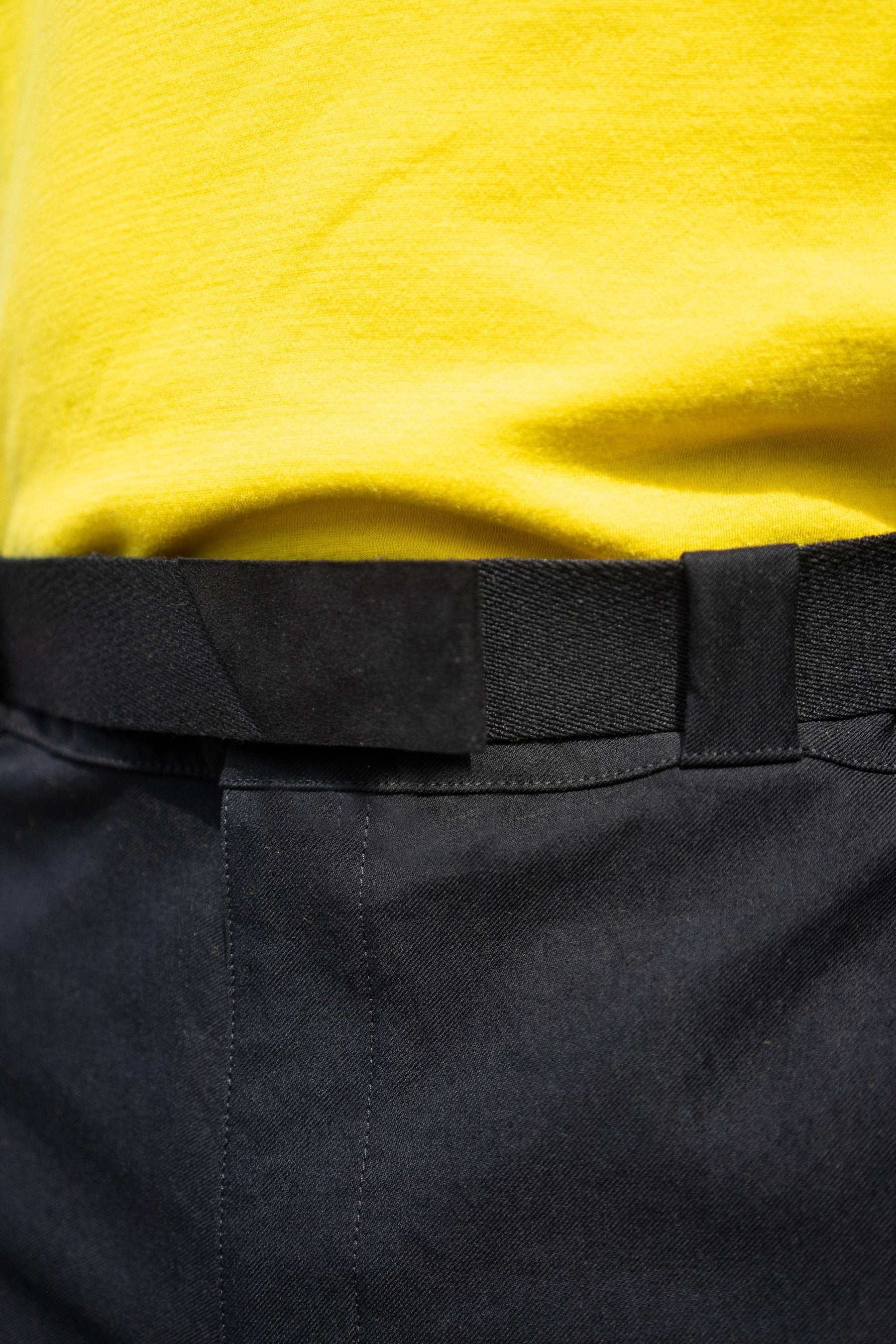 Close crop of the Experiment 242 - Polyamour Precision Belt with the Cottonweight Cut One T-shirt in Yellow and the Bombpaints in Black
