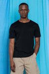 Waist up fit image of Torey wearing the Dreamweight Rawcut Shortsleeve in Black